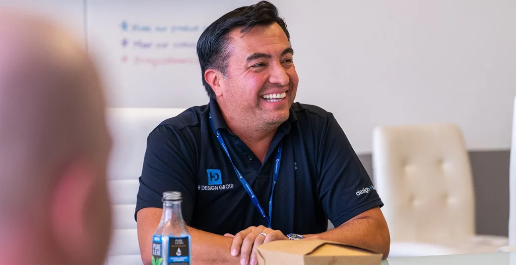 Man sitting at table enjoying lunch and mingling