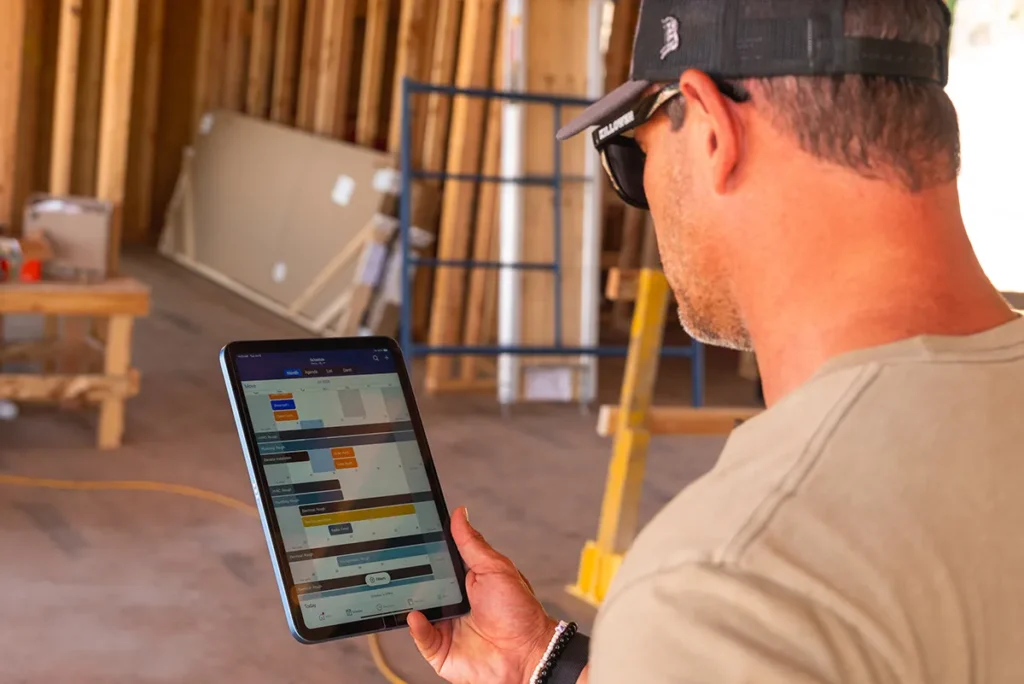 Zoomed in photo of man looking at a tablet